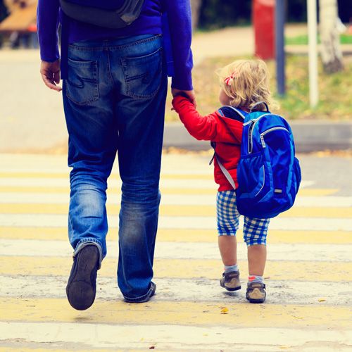 Father walking child to school